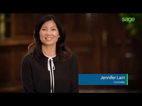 Still from a Sage customer video showing a woman captioned Jennifer Lam, Controller, seated in a dark panelled office interior with the Sage logo in the top corner
