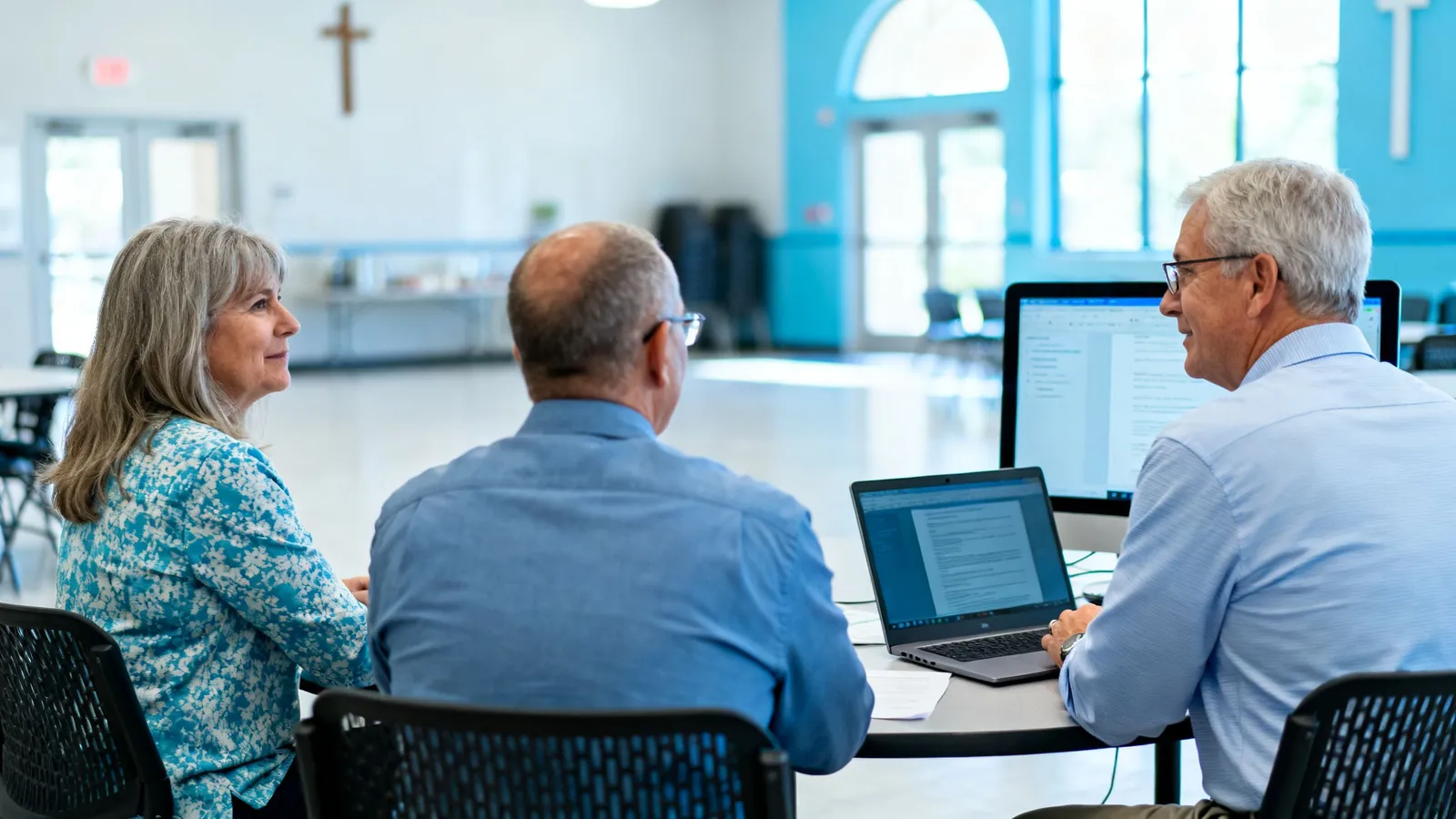 A church finance committee meeting in a fellowship hall